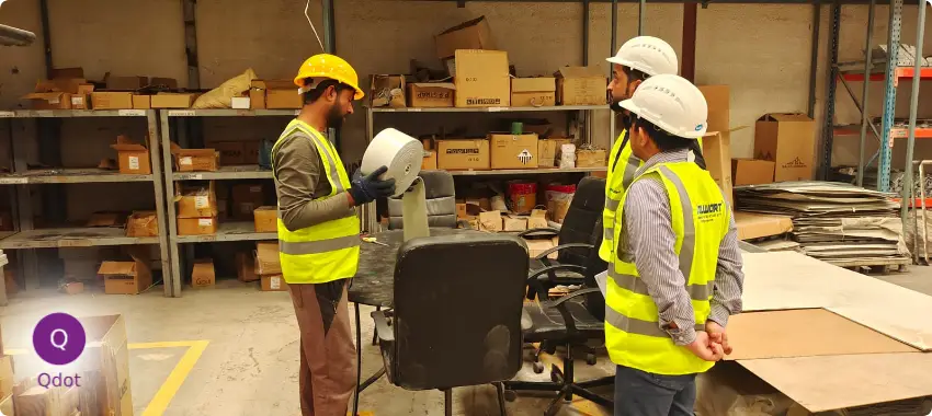 Qdot consultants conducting on-site quality inspection and process evaluation for ISO 9001 compliance.