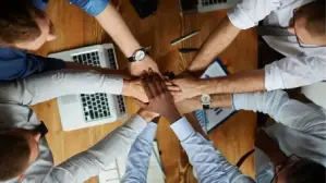 Businessman with holographic icons explaining ISO 9001 certification process in UAE